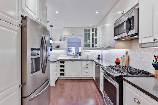 A clean kitchen with modern stainless steel appliances.