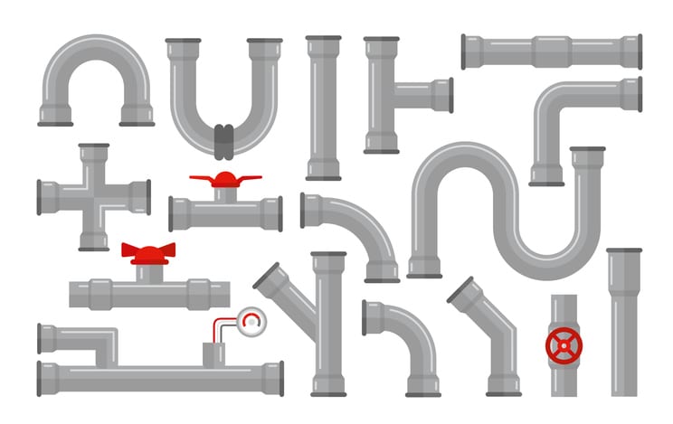 An assortment of PVC pipe joints, valves, and connectors.