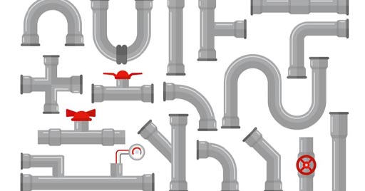 An assortment of PVC pipe joints, valves, and connectors.