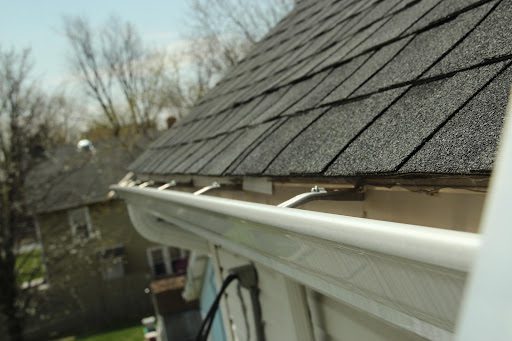 Clean white gutters on a two-story home